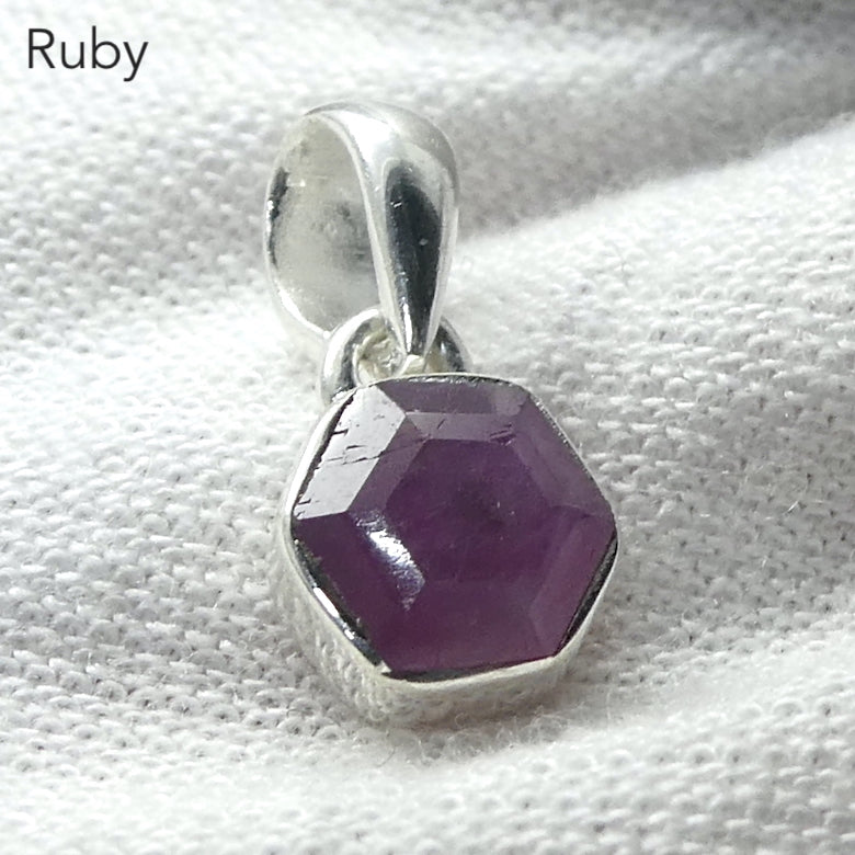 Ruby Pendant | Small but perfect faceted hexagonal slice of natural Ruby Crystal showing internal structure | Pinkish Red | 925 Sterling Silver | Claw set | Genuine Gems from Crystal Heart Melbourne Australia  since 1986