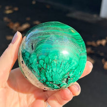 Load image into Gallery viewer, Malachite Sphere | Beautiful material from the Congo | Complex and fascinating swirls and rosettes | Pockets and caves sparkle with crystalline Malachite | Genuine Gems from Crystal Heart Melbourne Australia since 1986