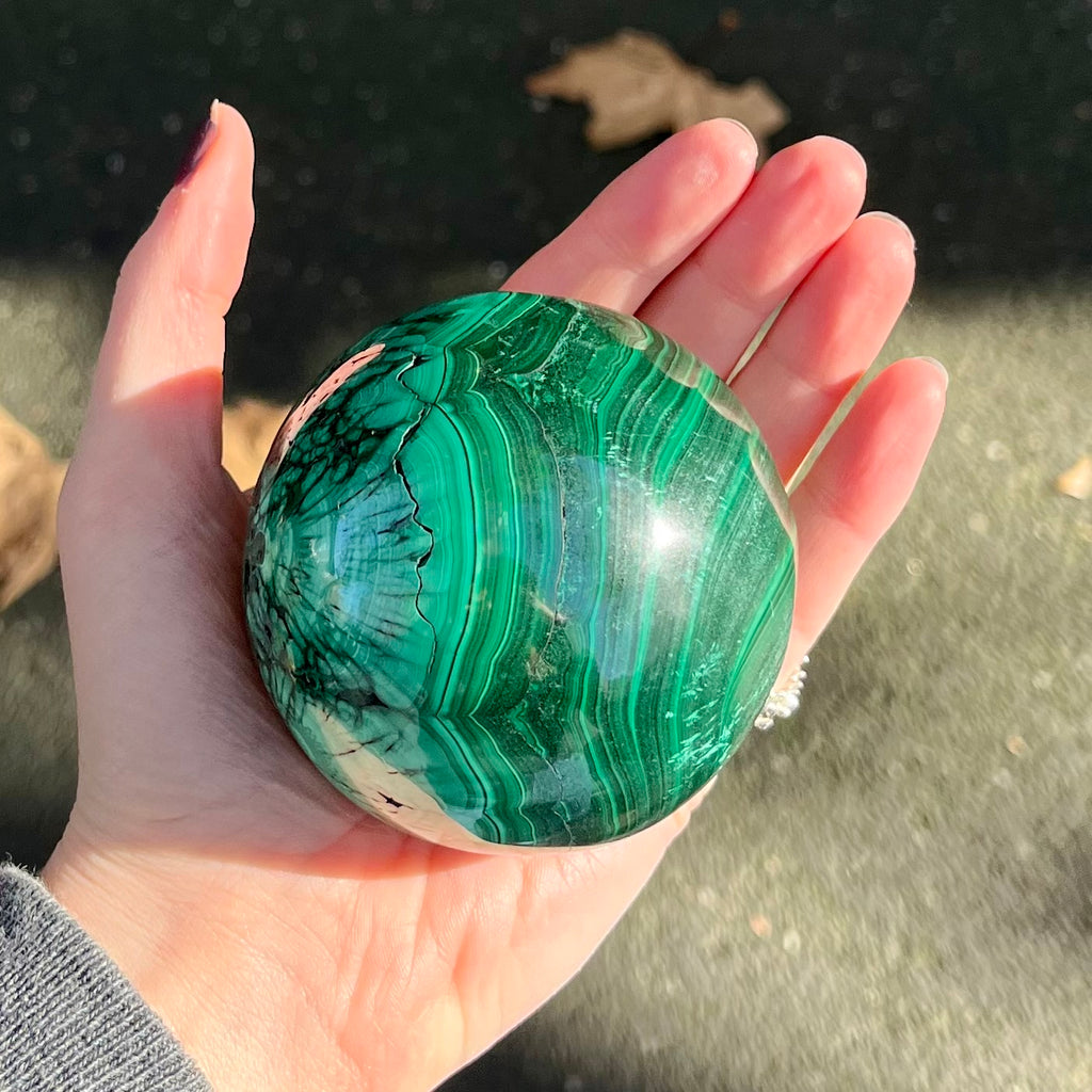Malachite Sphere | Beautiful material from the Congo | Complex and fascinating swirls and rosettes | Pockets and caves sparkle with crystalline Malachite | Genuine Gems from Crystal Heart Melbourne Australia since 1986'