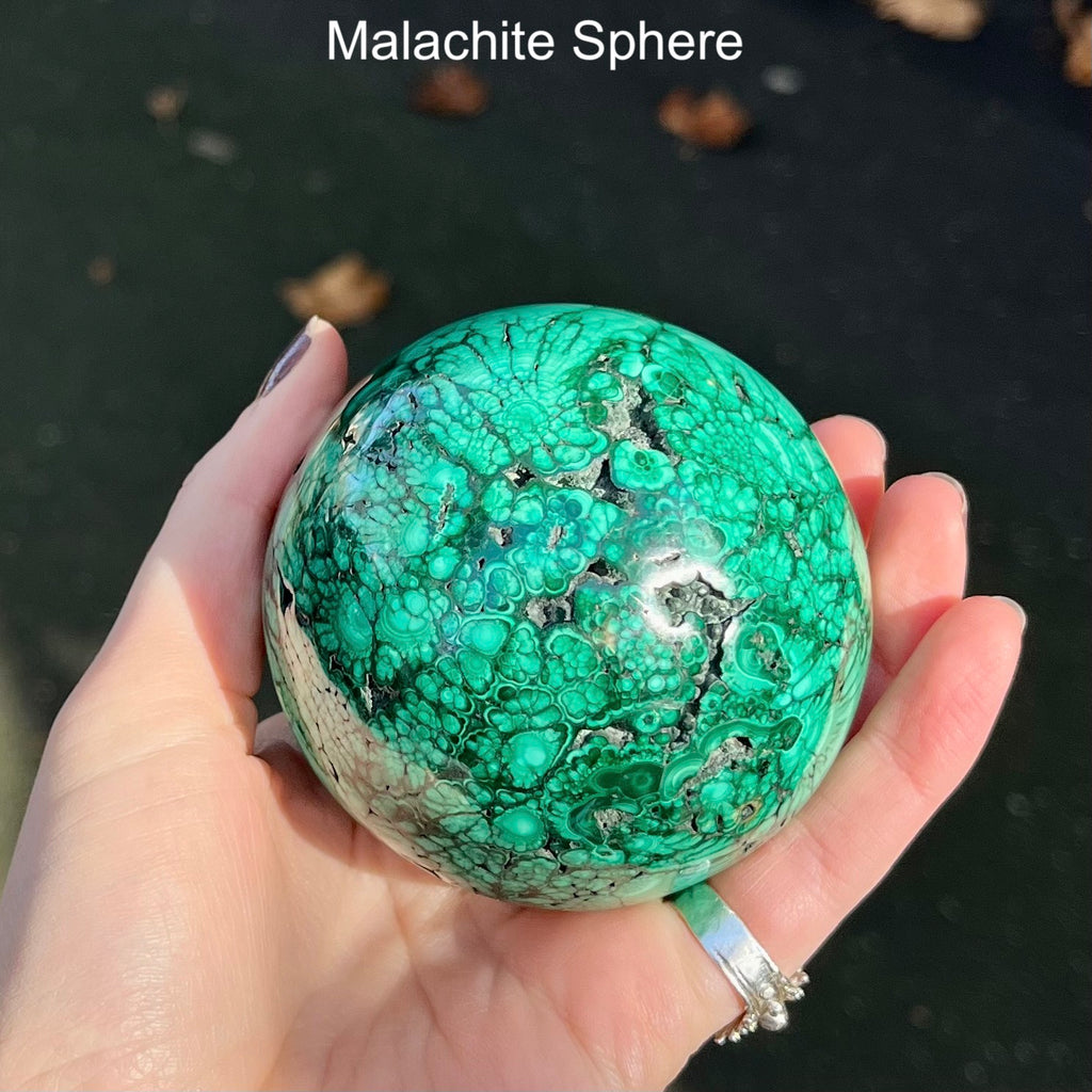 Malachite Sphere | Beautiful material from the Congo | Complex and fascinating swirls and rosettes | Pockets and caves sparkle with crystalline Malachite | Genuine Gems from Crystal Heart Melbourne Australia since 1986