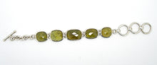 Load image into Gallery viewer, 5 large faceted Grossular Garnets, Besel set, hinged together to make a very different Bracelet | These rare Garnets are Green, the name comes from the Latin for Gooseberry | Adjustable length up to 180 mm | Crystal Heart Melbourne since 1986