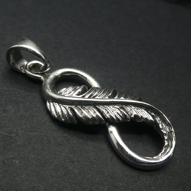 Silver Feather Pendant | shaped into the Infinity or eternity symbol | beautifully executed detail | 925 Oxidised Sterling Silver | Crystal Heart Melbourne Australia since 1986