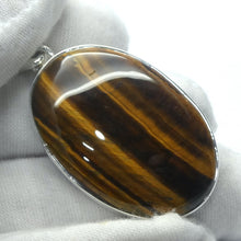 Load image into Gallery viewer, Tiger Eye Pendant | Good Chatoyancy |  Cabochon | 925 Sterling Silver | Bezel Set | Stimulate Mental &amp; Emotional focus | study | Sports | Mind Body Integration | Health | Genuine Gems from Crystal Heart since 1986Tiger Eye Pendant | Good Chatoyancy |  Cabochon | 925 Sterling Silver | Bezel Set | Stimulate Mental &amp; Emotional focus | study | Sports | Mind Body Integration | Health | Genuine Gems from Crystal Heart since 1986