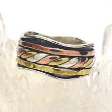 Load image into Gallery viewer, Spinning Ring 3 tone colour | 925 Sterling Silver | 10 mm band with silver wave pattern | 3 spinning bands, the central one a 3 tone knot work | The Brass and Copper look like Yellow and Rose Gold | Crystal Heart Melbourne Australia since 1986