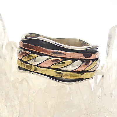 Spinning Ring 3 tone colour | 925 Sterling Silver | 10 mm band with silver wave pattern | 3 spinning bands, the central one a 3 tone knot work | The Brass and Copper look like Yellow and Rose Gold | Crystal Heart Melbourne Australia since 1986