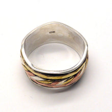 Load image into Gallery viewer, Spinning Ring 3 tone colour | 925 Sterling Silver | 10 mm band with silver wave pattern | 3 spinning bands, the central one a 3 tone knot work | The Brass and Copper look like Yellow and Rose Gold | Crystal Heart Melbourne Australia since 1986