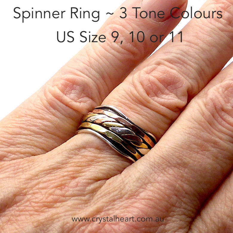 Spinning Ring 3 tone colour | 925 Sterling Silver | 10 mm band with silver wave pattern | 3 spinning bands, the central one a 3 tone knot work | The Brass and Copper look like Yellow and Rose Gold | US Sizes 8,9,10,11 and 12 | Crystal Heart Melbourne Australia since 1986