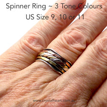 Load image into Gallery viewer, Spinning Ring 3 tone colour | 925 Sterling Silver | 10 mm band with silver wave pattern | 3 spinning bands, the central one a 3 tone knot work | The Brass and Copper look like Yellow and Rose Gold | US Sizes 8,9,10,11 and 12 | Crystal Heart Melbourne Australia since 1986