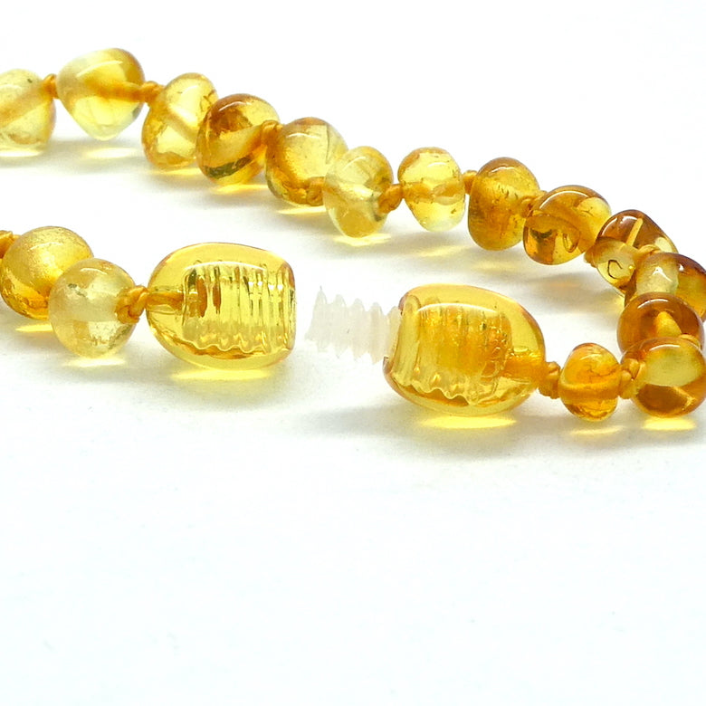 Baby Teething Bracelet | Baltic Amber Freeform Nuggets | Strong Screw Clasp | knotted between nuggets | Strong Coated THread | Genuine Gems from Crystal heart Melbourne Australia since 1986