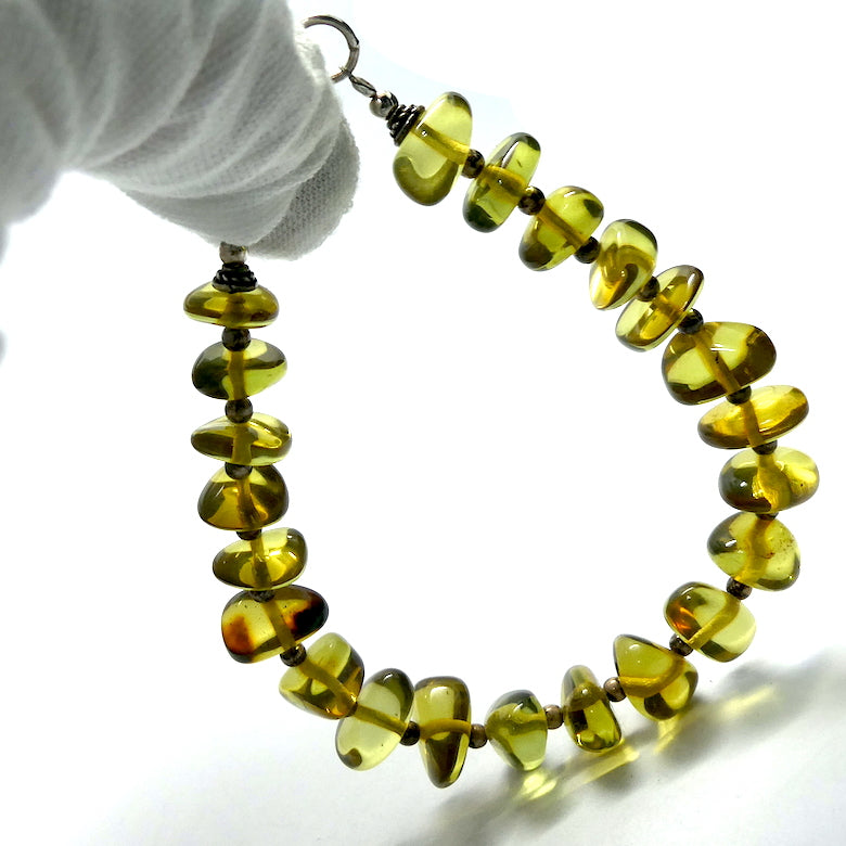 Green Baltic Amber Bracelet | Polished Freeform Nuggets | Beaded with 925 Silver Clasp and Spacer beads between the nuggets | Genuine Gems from Crystal heart Melbourne Australia since 1986