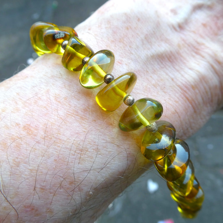 Green Baltic Amber Bracelet | Polished Freeform Nuggets | Beaded with 925 Silver Clasp and Spacer beads between the nuggets | Genuine Gems from Crystal heart Melbourne Australia since 1986