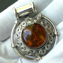 Load image into Gallery viewer, Amber Pendant | Large Round Cabochon  |  Sterling Silver Disc |  Celtic Scroll and Rope Work | Genuine Gems from Crystal heart Melbourne Australia since 1986