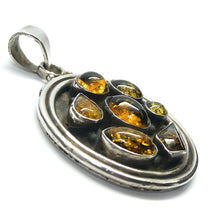 Load image into Gallery viewer, Amber Pendant | Seven Dark Amber Cabochons  | Heavy Sterling Silver Disc |  Oxidised | Mediaeval or Gothic Look | Genuine Gems from Crystal heart Melbourne Australia since 1986