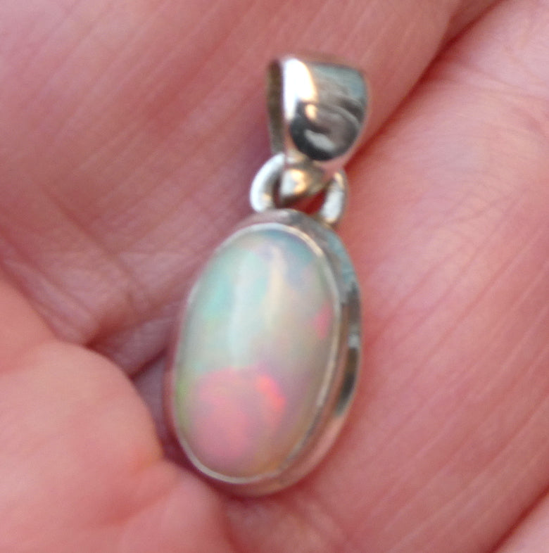 Ethiopian Opal Pendant | Oval Cabochon | Green red blueFlashes | Simple Bezel Setting | Open Back | | 925 Silver | Genuine Gems from Crystal Heart Australia since 1986