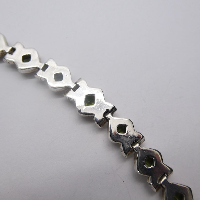 Peridot Bracelet | Thirteen Faceted Squares | 925 Sterling Silver | Bezel Set | Open Backs | Adjustable length | Crystal Heart Melbourne Australia since 1986