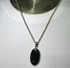 Nuummite Pendant | 925 Sterling Silver | Oval Cabochon | Black with Golden Flecks | Soul Retrieval | Clear emotional entanglements | Genuine Gemstones from Crystal Heart Melbourne Australia since 1986 | nuumite | nummite