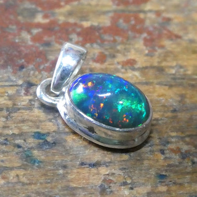 Black Opal Pendant | Ethiopian | Oval | Green Red Flashes | Simple Bezel Setting | Open Back | | 925 Silver | Genuine Gems from Crystal Heart Australia 1986