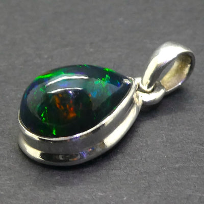 Black Opal Pendant | Ethiopian | Teardrop | Green Red Flashes | Simple Bezel Setting | Open Back | | 925 Silver | Genuine Gems from Crystal Heart Australia 1986