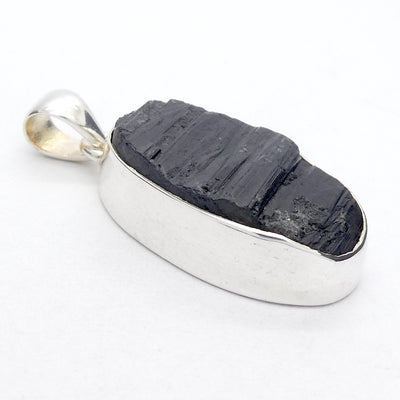 Black Tourmaline Pendant | Raw unpolished crystal | Oval shape | Bezel set | 925 Sterling Silver | Genuine Gems from Crystal Heart Melbourne Australia since 1986