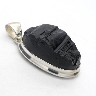 Black Tourmaline Pendant | Raw unpolished crystal | Oval shape | Bezel set | 925 Sterling Silver | Genuine Gems from Crystal Heart Melbourne Australia since 1986
