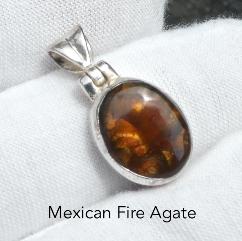 Mexican Fire Agate Pendant | Raw Nugget | Good Colour Flashes | Bezel Set with open back | 925 Sterling Silver | Genuine Gems from Crystal Heart Melbourne Australia since 1986Mexican Fire Agate Pendant | Freeform Cabochon | Good Colour Flashes | Bezel Set with open back | 925 Sterling Silver | Genuine Gems from Crystal Heart Melbourne Australia since 1986