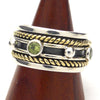 Spinner Ring with Peridot | 2 tone | 925 Sterling Silver | 4 Faceted stones set in spinning band over oxidised Silver held by Gold Plated Knotwork | Steampunk | Crystal Heart Melbourne Australia since 1986