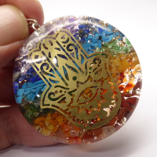 Orgone Crystal Chakra Pendant | Disc of Orgonite embedded with Chakra Crystals, promoting personal Harmony | Embedded Hand of Hamsa is a protective symbol | Crystal Heart Melbourne Australia since 1986