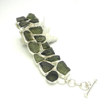 Load image into Gallery viewer, Bracelet with 19 Raw Natural Moldavite nuggets set in two lines | Bezel Set with Open backs | 925 Sterling Silver  Green Obsidian | CZ Republic | Intense Personal Heart Transformation and Connection | Scorpio Stone | Genuine Gems from Crystal Heart Melbourne Australia since 1986