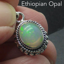 Load image into Gallery viewer, Ethiopian Solid Opal Pendant | Small Oval Cabochon | Green &amp; Red Flash | 925 Silver | Bezel Setting with 3 layers of ornamentation surrounding | Open Back | Genuine Gems from Crystal Heart Australia since 1986