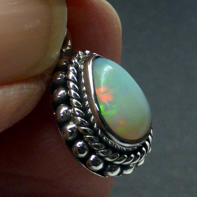 Ethiopian Solid Opal Pendant | Small Teardrop Cabochon | Green & Red Flash | 925 Silver | Bezel Setting with 3 layers of ornamentation surrounding | Open Back | Genuine Gems from Crystal Heart Australia since 1986