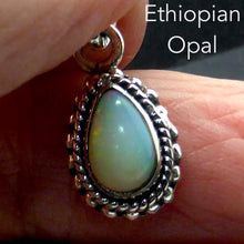 Load image into Gallery viewer, Ethiopian Solid Opal Pendant | Small Teardrop Cabochon | Green &amp; Red Flash | 925 Silver | Bezel Setting with 3 layers of ornamentation surrounding | Open Back | Genuine Gems from Crystal Heart Australia since 1986